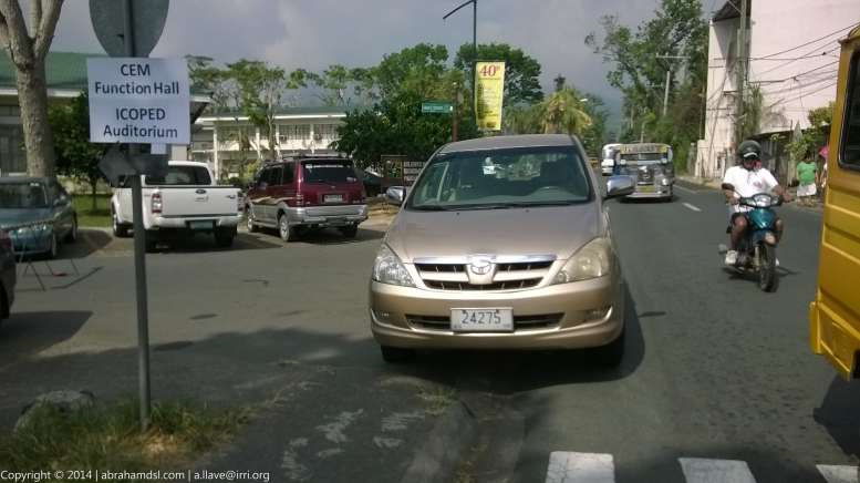 A Toyota Innova Asian Utility Vehicle (AUV) with diplomatic plate, perhpas illegally parked.